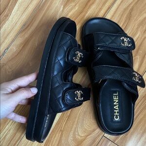 CHANEL Black Quilted Sandals with Gold Accents